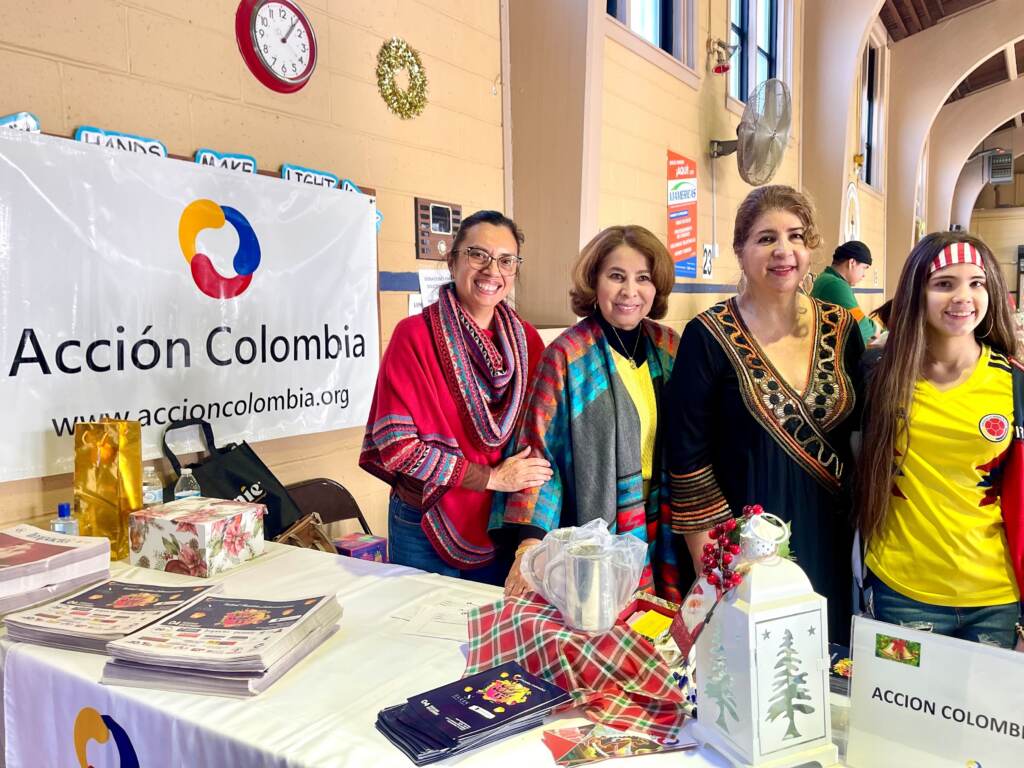 IMG_8580 Executive Director of Accion Colombia, Leity Rodriguez-Largo (second from right), alongside her colleagues and volunteers of Sal y Dulce. (Johnny Perez-Gonzalez/WHYY)