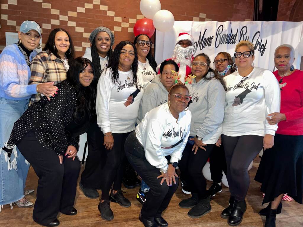 IMG_8674 Moms Bonded by Grief's founder (fourth from right) with the moms who attended the organization's holiday party