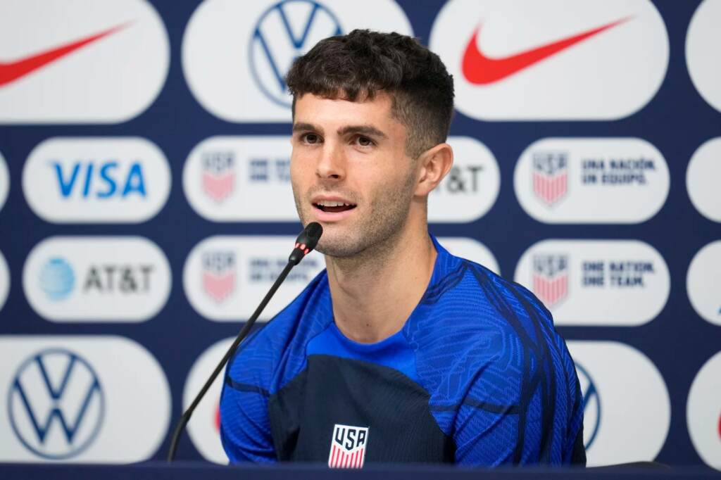 ap22335563801854_slide-e5bddf86102fbfefb97b381a2449f9abd72bb258-s1600-c85 Christian Pulisic of the United States attends a news conference before a training session at Al-Gharafa SC Stadium, in Doha, Thursday, Dec. 1, 2022. (Ashley Landis/AP)