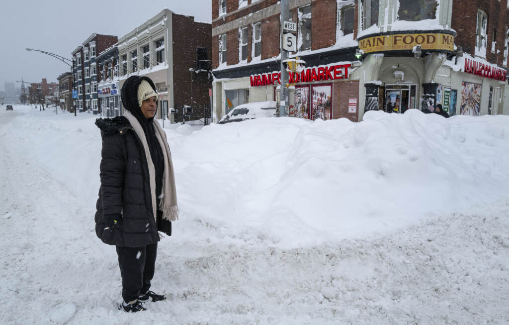 Kala Smith of Buffalo, N.Y., heads for a food store Monday on Main Street, not far from where she lives, after a massive snowstorm blanketed the city. Kala Smith of Buffalo, N.Y., heads for a food store Monday on Main Street, not far from where she lives, after a massive snowstorm blanketed the city. (Craig Ruttle/AP)
