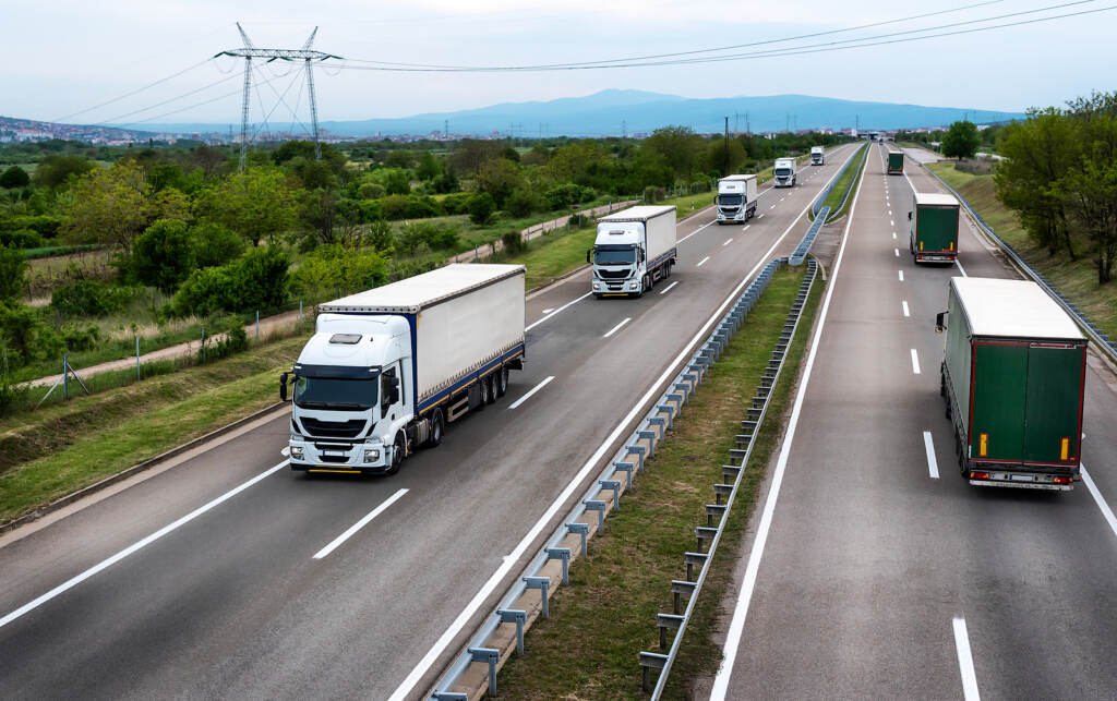 White Trucks On Highway – Heavy Truck Traffic On The Highway In (IvanSpasic/BigStock)