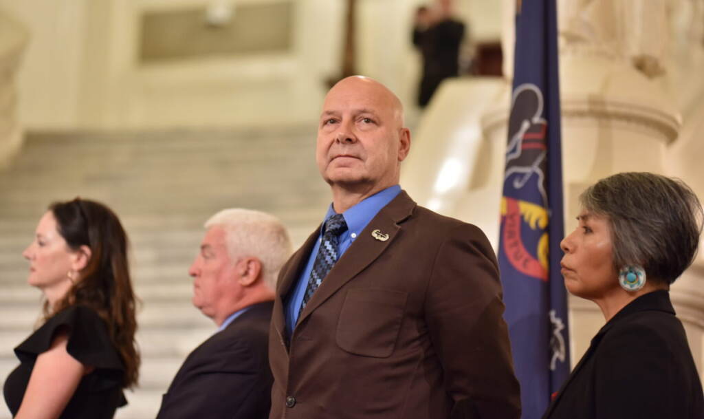 doug-mastriano-SD-123022 State Sen. Doug Mastriano (R-Franklin), the 2022 Republican candidate for governor, glances into a crowd gathered for a rally celebrating William Penn in the state Capitol rotunda in Harrisburg on July 1, 2022. (Sam Dunklau/WITF)