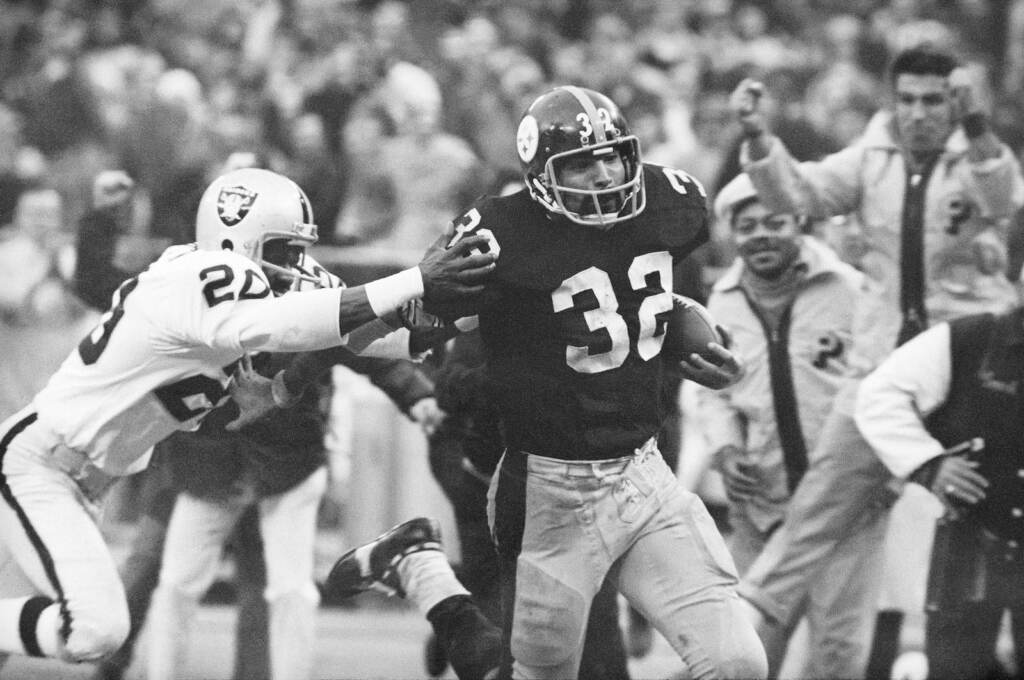 Franco Harris, Jimmy Warren Franco Harris (32) eludes a tackle by Oakland Raiders' Jimmy Warren as he runs 42-yards for a touchdown after catching a deflected pass during an AFC Divisional NFL football playoff game in 1972