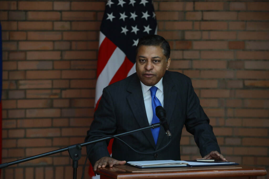 A person stands at a podium.