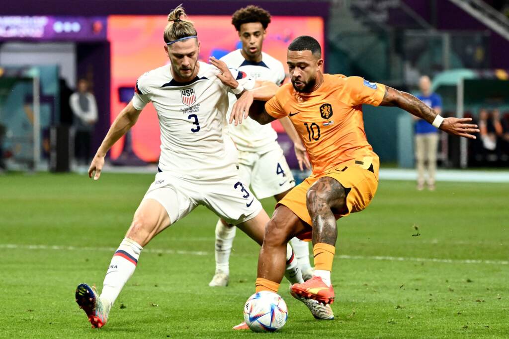 USA defender Walker Zimmerman (#3) fights for the ball with Netherlands’ forward Memphis Depay during the 2022 World Cup round of 16 match at Khalifa International Stadium in Al Rayyan, Qatar on December 3, 2022. USA defender Walker Zimmerman (#3) fights for the ball with Netherlands' forward Memphis Depay during the 2022 World Cup round of 16 match at Khalifa International Stadium in Al Rayyan, Qatar on December 3, 2022. (Jewel Samad/AFP via Getty Images)