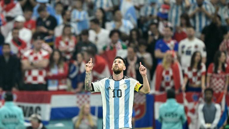 Argentina forward Lionel Messi celebrates scoring his team's first goal from the penalty spot during the World Cup semifinal match between Argentina and Croatia in Qatar on December 13, 2022. (Juan Mabromata/AFP via Getty Images)