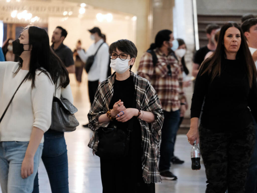 A woman wears a mask indoors in Manhattan
