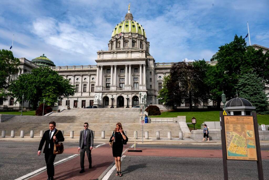 harrisburg-pa-capitol-building-TG-SPA-122722 People walk outside the Pennsylvania Capitol Building