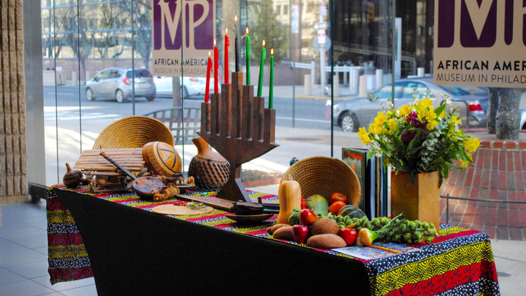 kwanzaa-table-kinara-crop FILE - Kwanzaa table at the African American Museum in Philadelphia