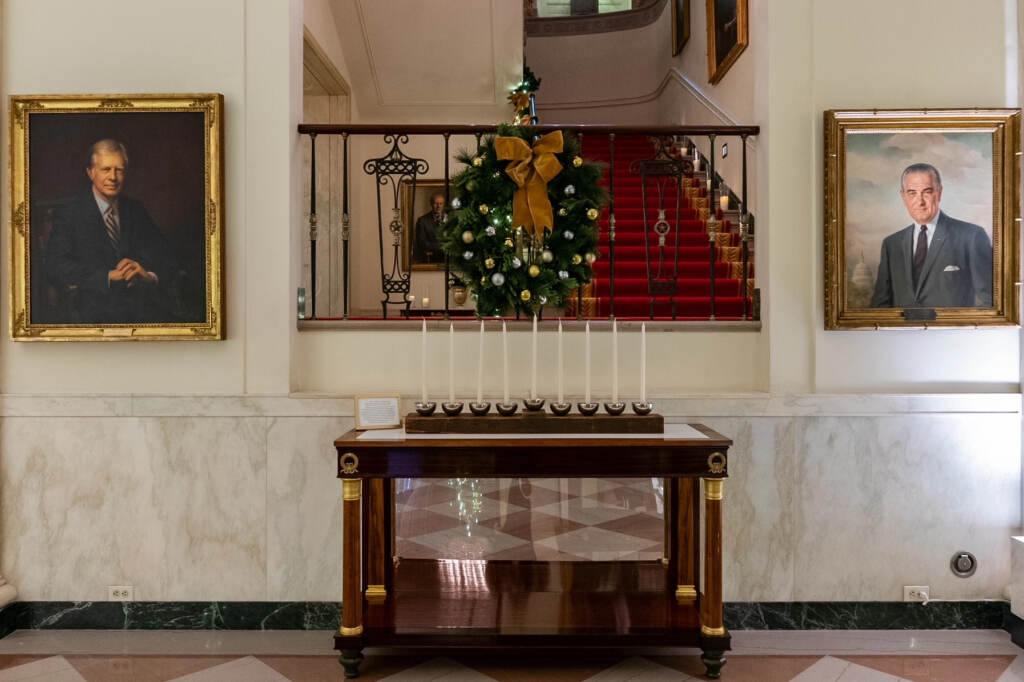 The White House Menorah can be seen in Cross Hall and is part of this year’s “We The People”-themed holiday display. The Bidens will add the menorah to the permanent White House collection at a Hanukkah reception Monday evening, The White House Menorah can be seen in Cross Hall and is part of this year's