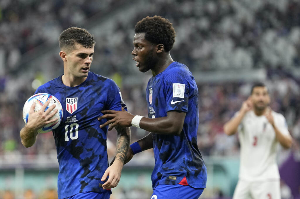 WCup Iran United States Soccer Christian Pulisic of the United States, left, and Yunus Musah of the United States speak before a free kick during the World Cup group B soccer match between Iran and the United States at the Al Thumama Stadium in Doha, Qatar, Tuesday, Nov. 29, 2022. (AP Photo/Ebrahim Noroozi)