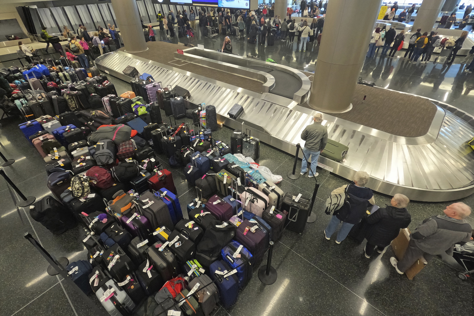 APTOPIX Winter Weather Travel Baggage waits to be claimed at the Southwest Airlines baggage claim