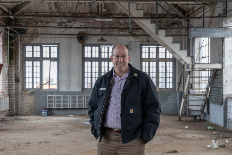 Developer Ken Weinstein inside the former Arguto Oilless Bearing Company and most recently a church building, that he plans to restore and turn into offices. (Kimberly Paynter/WHYY)