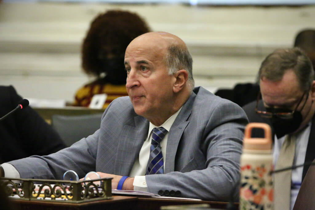 Philadelphia City Council Member Mark Squilla. (Emma Lee/WHYY) Councilmember Mark Squilla sits at a desk in council chambers.