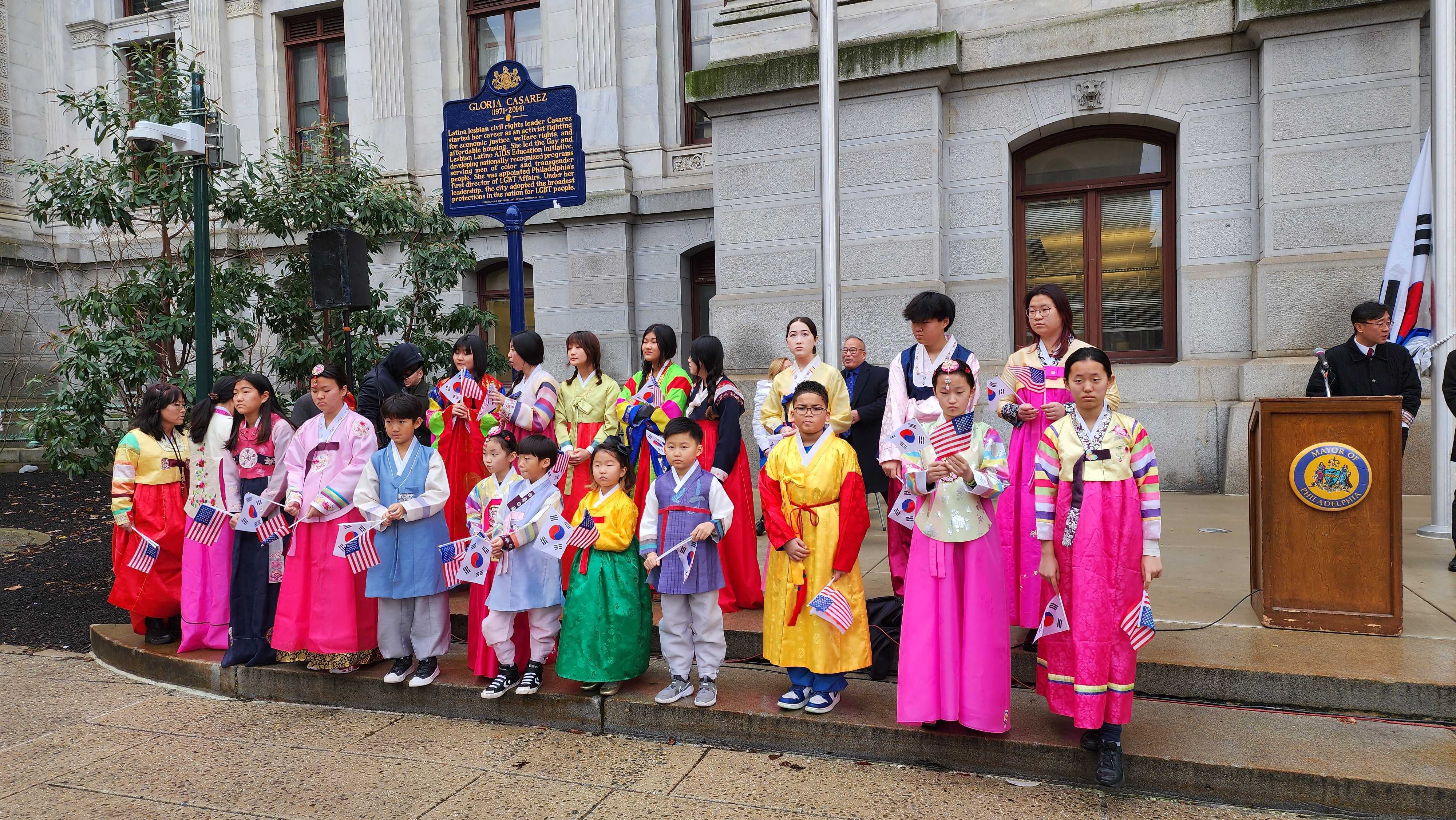 20230113_100025 The children's choir of the National Association of Korean Schools sang the Korean National Anthem during the flag raising ceremony at City Hall. (Tom MacDonald/WHYY)