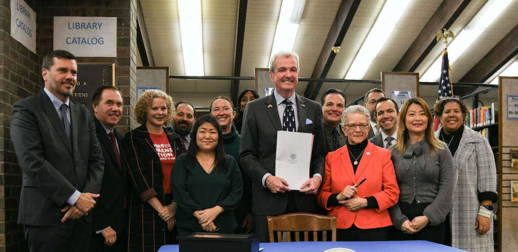Governor Murphy Signs Gun Safety Legislation Governor Murphy hold up signed gun safety legislation