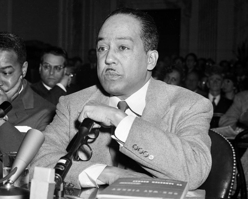 This March 26, 1953, file photo shows poet and author Langston Hughes speaking before the House Un-American Activities Committee