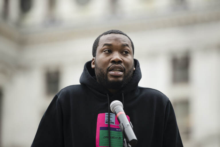 In this April 2, 2019, file photo, rapper Meek Mill speaks at a gathering in Philadelphia to push for drastic changes to Pennsylvania's probation system. Philadelphia's District Attorney's office wants a new trial with a new judge for rapper Meek Mill. Larry Krasner submitted the brief Wednesday, May 22, 2019. He said former Judge Genece Brinkley's court 
