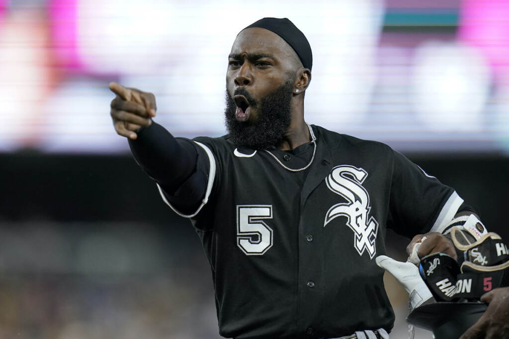 White Sox Padres Baseball Chicago White Sox's Josh Harrison jokes with players in the San Diego Padres dugout during the sixth inning of a baseball game