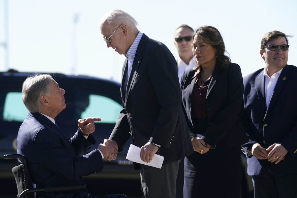 Joe Biden,Greg Abbott President Joe Biden shakes hands with Texas Gov. Greg Abbott