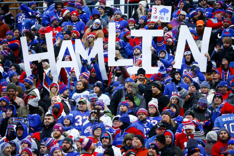 Fans hold a sign in support of Buffalo Bills safety Damar Hamlin during the second half of an NFL football game against the New England Patriots, Sunday, Jan. 8, 2023, in Orchard Park.