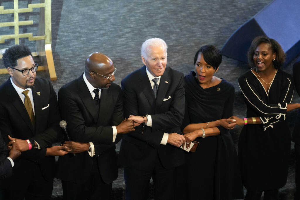 Joe Biden,Keisha Lance Bottoms,Raphael Warnock President Joe Biden, center, holds hands with Sen. Raphael Warnock, D-Ga., a senior pastor at Ebenezer Baptist Church, second from left, and Keisha Lance Bottoms, senior adviser to Biden for public engagement and former Atlanta Mayor, second from right, after Biden spoke at Ebenezer Baptist Church in Atlanta, Sunday, Jan. 15, 2023, during a service honoring Martin Luther King Jr
