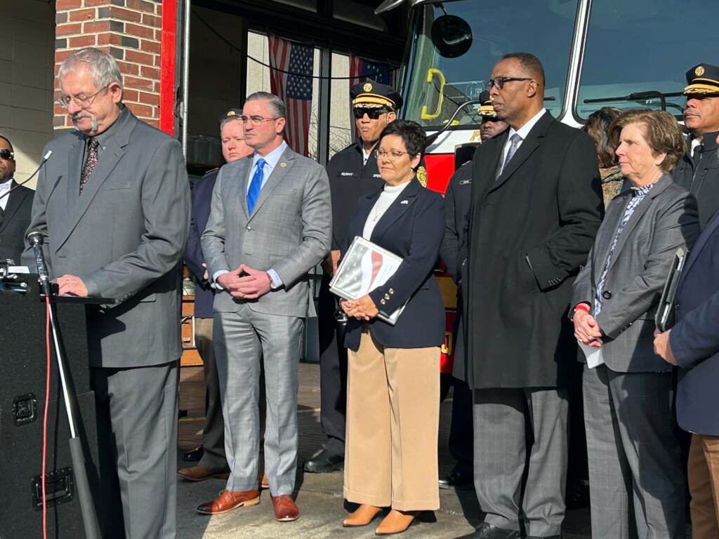 Fire-Administrator-Lori-Moore-Merrell-2023-01-11-s-schmidt U.S. Fire Administrator Lori Moore-Merrell (center) stands with city officials and representatives of national fire safety organizations at a press event in Philly Wednesday. (Sophia Schmidt/WHYY)