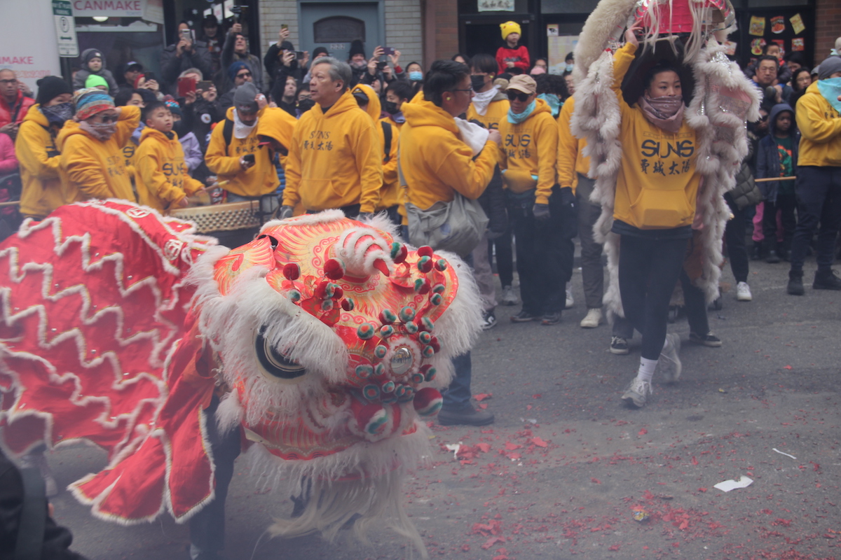 Generations of Philadelphians celebrated the Lunar New Year with music, fireworks, and dancing lions through the streets of Chinatown on Jan. 22, 2023. (Cory Sharber/WHYY)