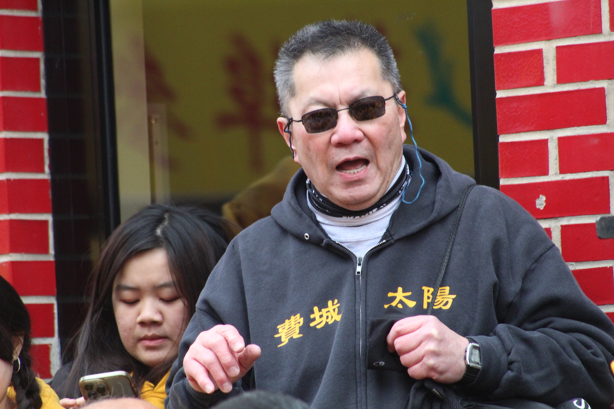 Philadelphia Suns advisor and Chinatown resident Joe Lowe helped bring in the Lunar New Year on Sunday. (Cory Sharber/WHYY)