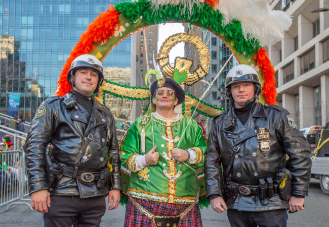 23-year parade veteran L.J. Cooney of Newark Delaware poses with 2 Philadelphia Highway Patrolmen. (Jonathan Wilson for WHY)