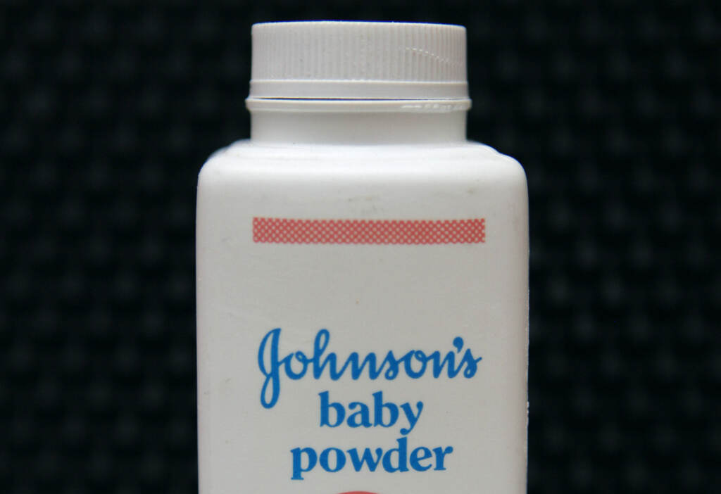 Johnson & Johnson announced last year that it would suspend all talc baby powder sales worldwide. a bottle of Johnson's baby powder is displayed
