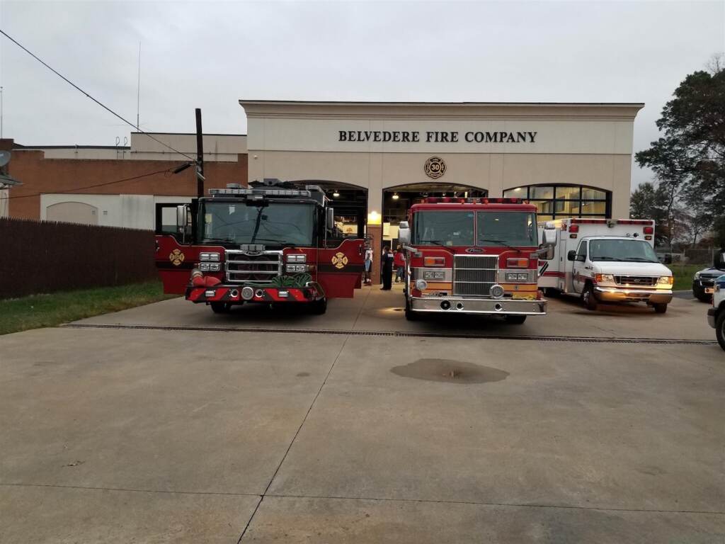 belvedere-fire A wide shot of a fire station with fire trucks parked in front of it.