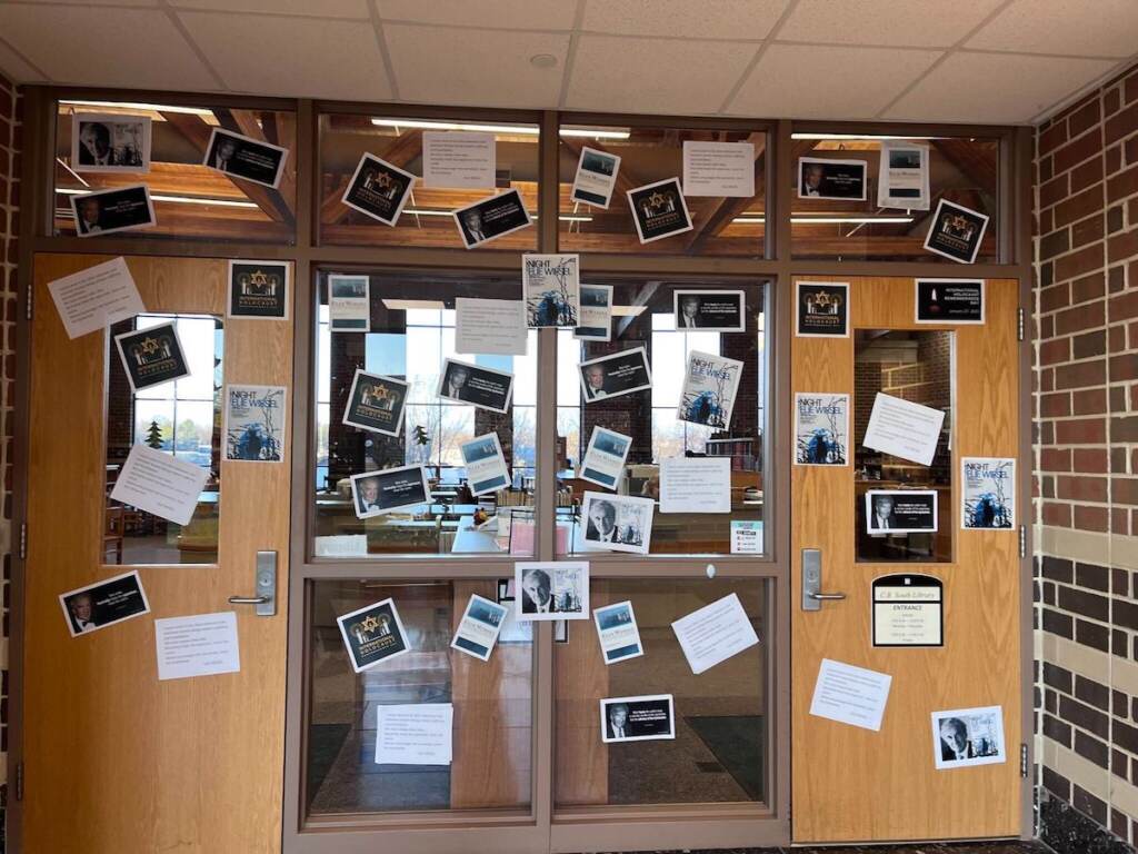 cbsd-poster-quote Posters are papered on doors.