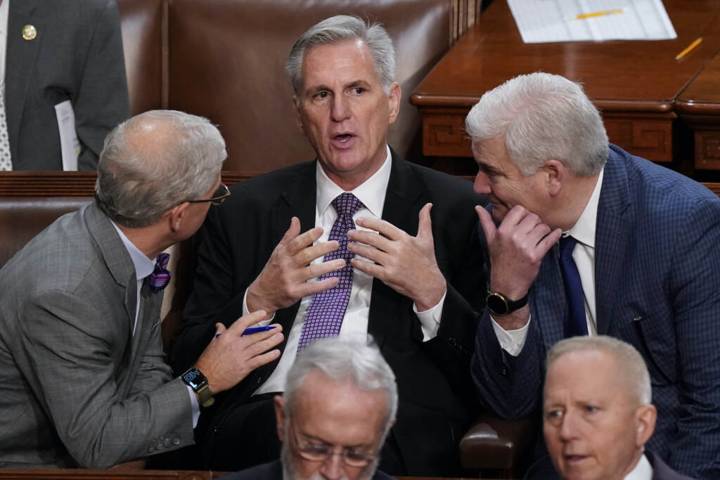 Patrick McHenry, Tom Emmer, Kevin McCarthy Rep. Patrick McHenry, R-N.C., left, and Rep. Tom Emmer, R-Minn., right, speaks with Rep. Kevin McCarthy, R-Calif., in the House chamber as the House meets for a second day to elect a speaker and convene the 118th Congress in Washington, Wednesday, Jan. 4, 2023. (AP Photo/Alex Brandon)