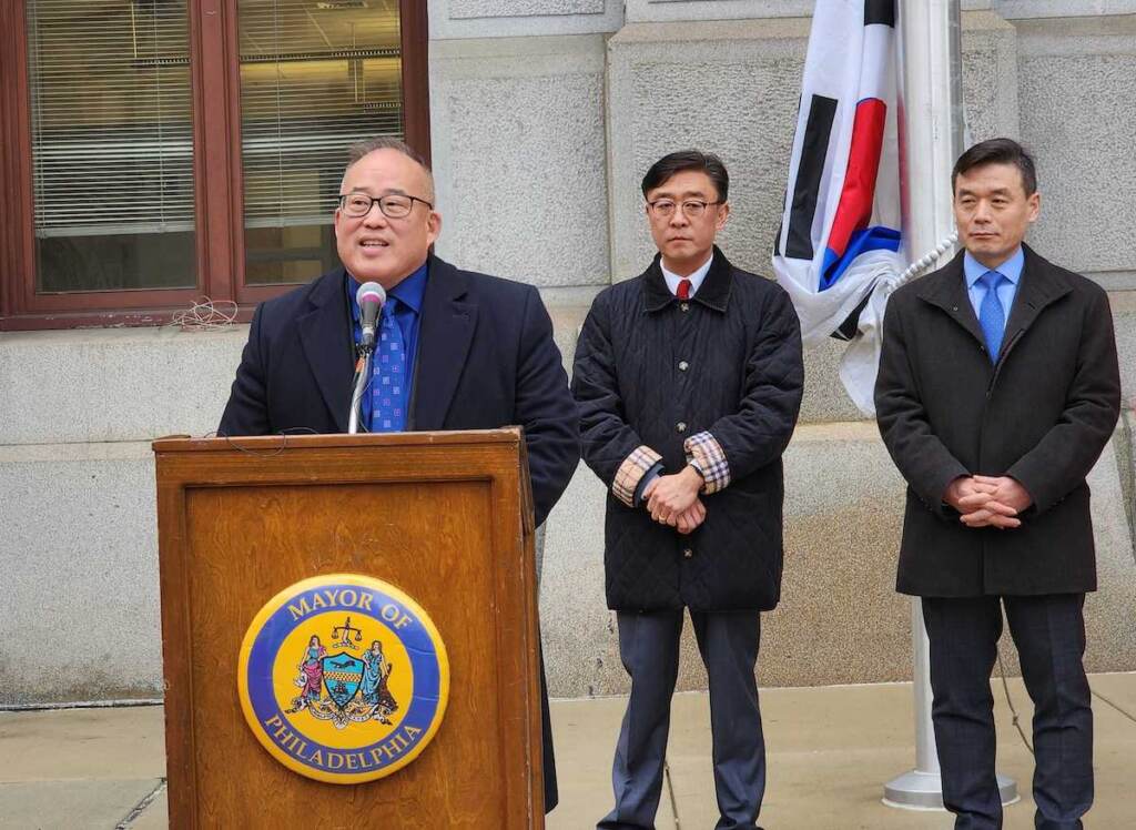 david-oh-jan-13-23 David Oh speaks at a podium outside of City Hall.
