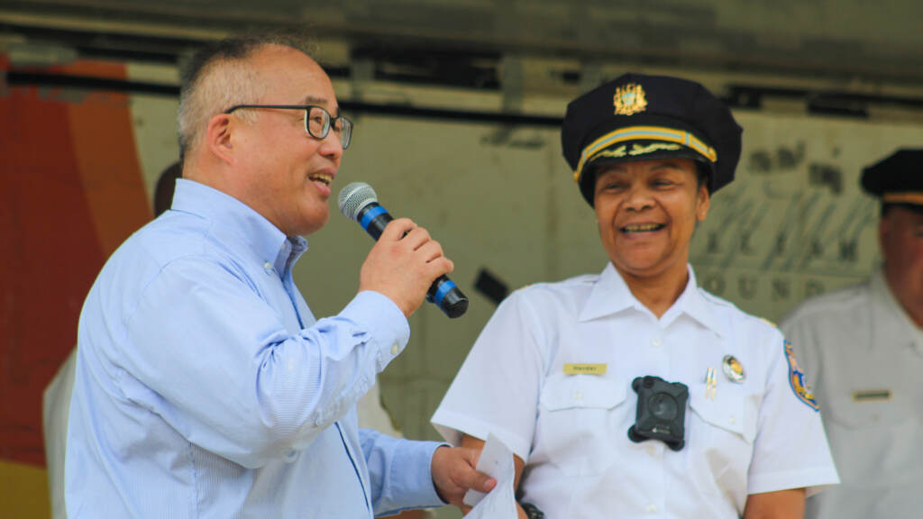 davidoh-police-crop David Oh with 16th District Police Captain Chanta Herder at an August 2022 event discussing relationships between first responders and communities. (Cory Sharber/WHYY)