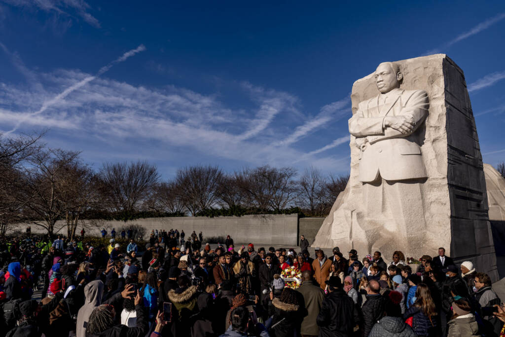 A large group gathers to watch a wreath-laying ceremony at the Martin Luther King Jr. Memorial