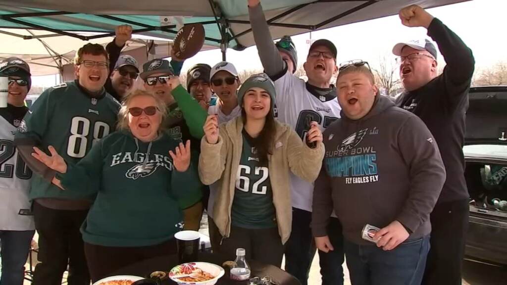 eagles-giants A group of Eagles fans pose for a photo.