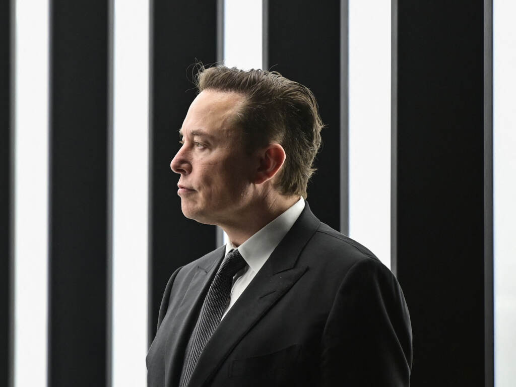 Tesla CEO Elon Musk, pictured here at a German factory in March 2022, faces a trial this week over his series of 2018 tweets teasing a Tesla buyout that never materialized. Tesla CEO Elon Musk, pictured here at a German factory in March 2022