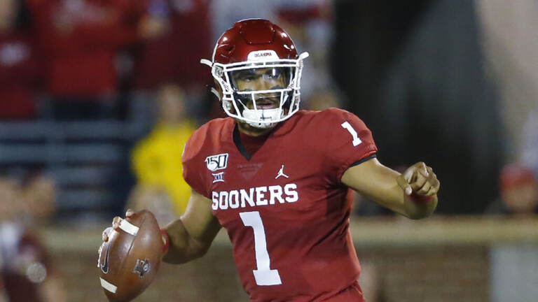 Jalen Hurts prepares to throw a football.
