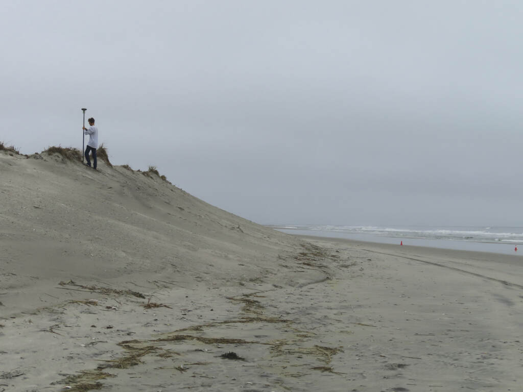 Survey work by a crew from Stockton University measures the countours of an eroded beach in North Wildwood, N.J. on Oct. 25, 2022. On Jan. 4, 2023, the city asked a judge to force the state environmental protection department to pay it $21 million to cover the cost of trucking in sand over the past decade. (AP Photo/Wayne Parry)