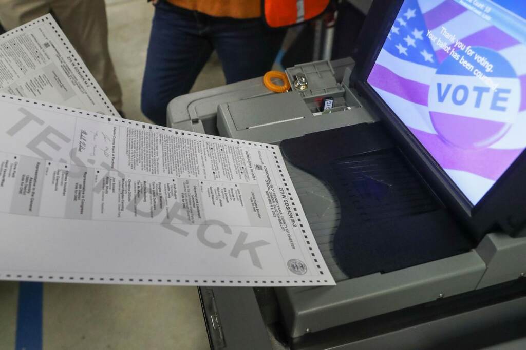 pa-constitutional-amendment A ballot is fed into a voting machine.