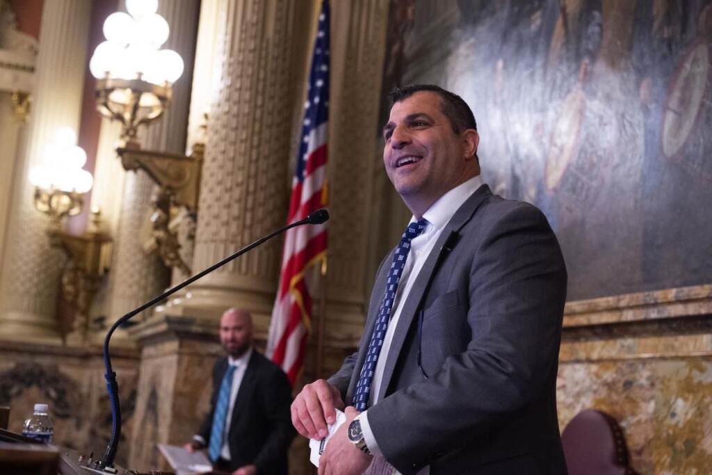rozzi-spotlight-pa Mark Rozzi stands at a podium in the state legislature room.