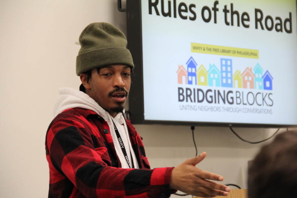 Amir Richardson gestures as he leads a community conversation.