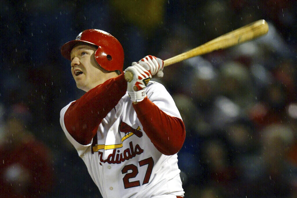 Hall of Fame Baseball A player swings a baseball bat.