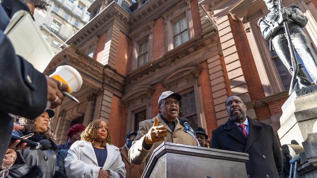 unionleague-desantis-01-1024×576 People speak from a podium in front of a building.