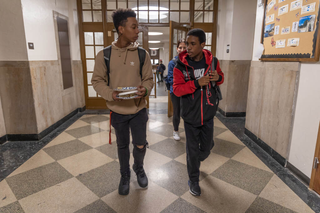 01 24 2023 k paynter synceir thorton taahzje ellis student dobbins-2 Synceir Thorton (right) and Taahzje Ellis (left), students at Dobbins Technical High School, walk together in the hall after school. (Kimberly Paynter/WHYY)