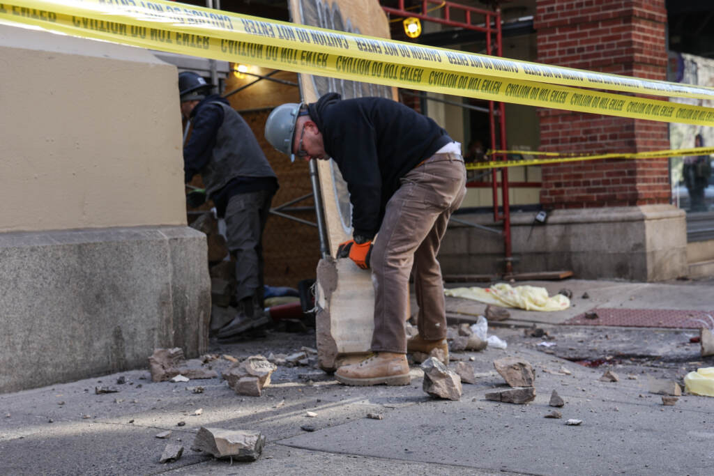 02 08 2023 K paynter 13th chancellor debris falling-2 (1) Construction workers moving debris