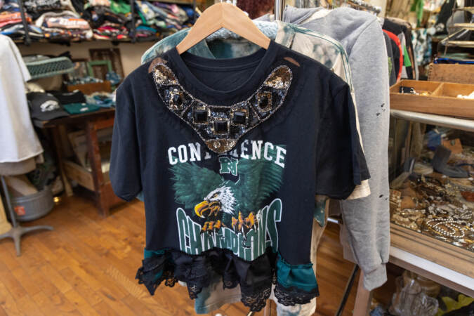 Jewels and sequins adorn an Eagles t-shirt at NRS Boutique in South Philadelphia. (Kimberly Paynter/WHYY)