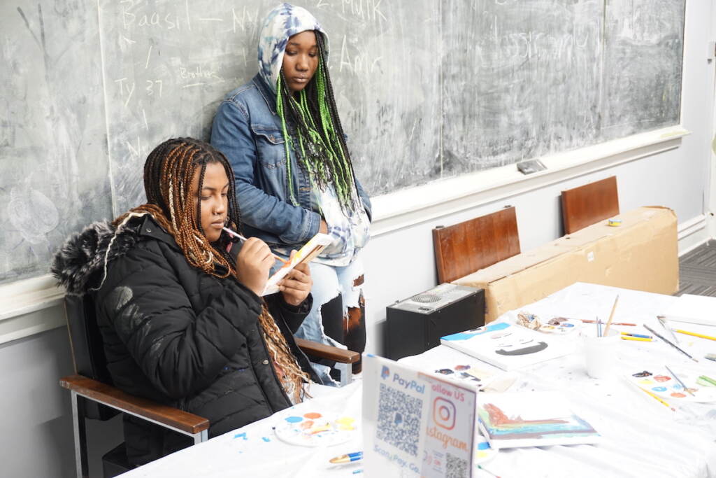 Two participants in the breakout session led by Power of Paint Art Academy
